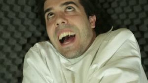 crazy man in straight jacket